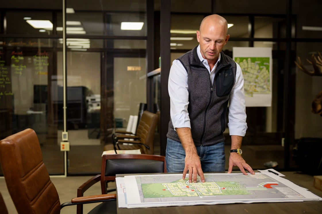 Image of Jason Roberts looking at a building plan
